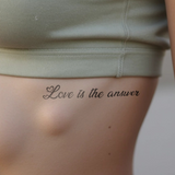 ''Love is the answer'' Tatoeage