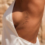 Subtiele roos tatoeage